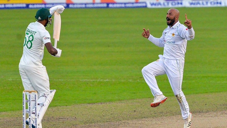 Pakistan's Sajid Khan (R) celebrates their victory during the final day of the second Test cricket match between Bangladesh and Pakistan at the Sher-e-Bangla National Cricket Stadium in Dhaka. Credit: AFP Photo