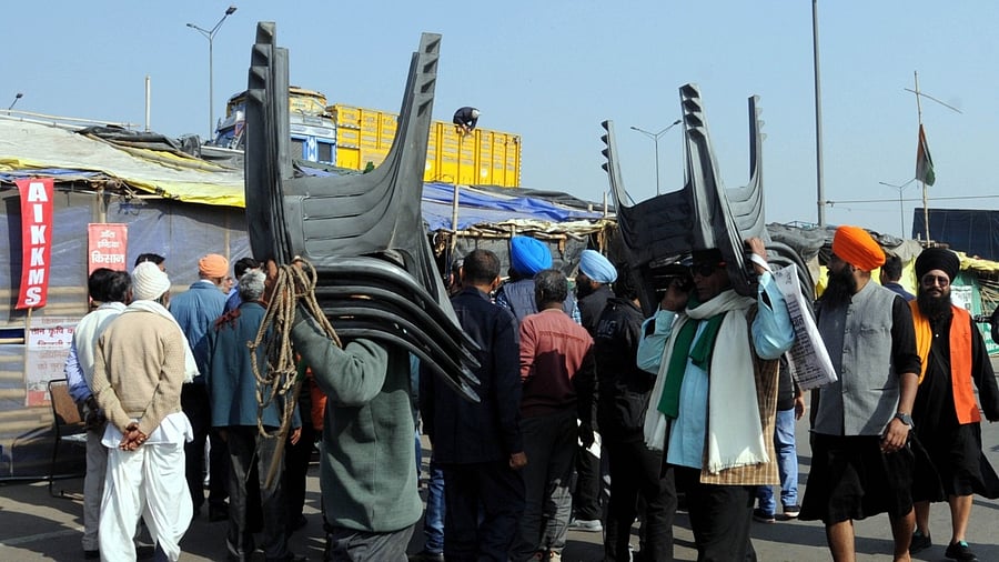 Farmers prepare to leave from the Ghazipur border after their year long agitation against contentious farm reform laws in New Delhi. Credit: IANS Photo