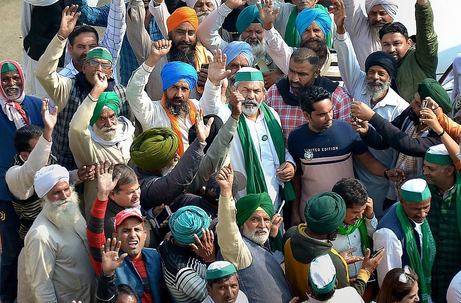Bharatiya Kisan Union (BKU) Spokesperson Rakesh Tikait reacts after a bill to cancel the three contentious farm laws was passed during the Winter Session of the Parliament. Credit: PTI Photo
