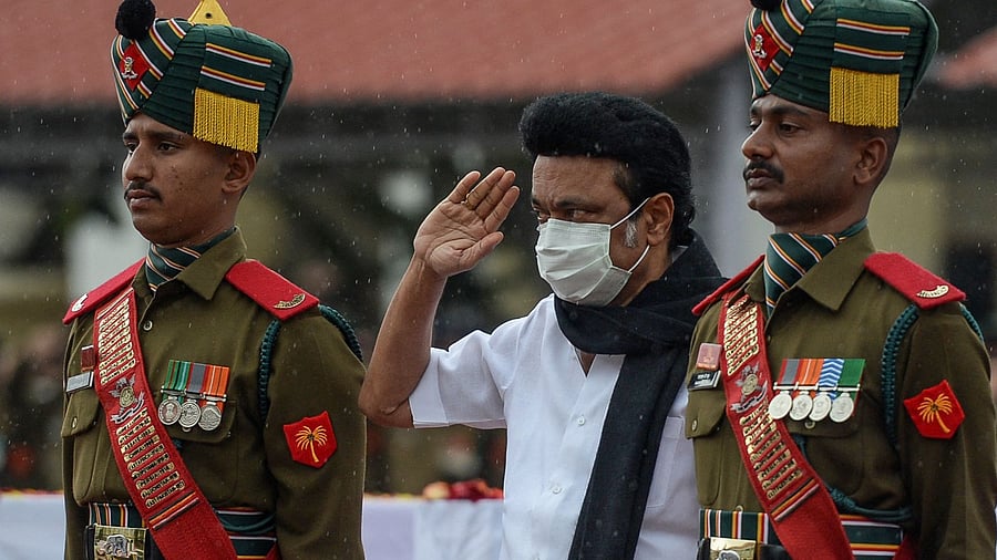 M. K. Stalin (C), Chief Minister of Tamil Nadu pay respect near the coffin containing the mortal remains of Indian defence chief General Bipin Rawat. Credit: AFP Photo