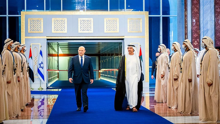 Minister of Foreign Affairs and International Cooperation H.H. Sheikh Abdullah bin Zayed Al Nahyan (R) walks with Israeli Prime Minister Naftali Bennett during a welcoming ceremony upon his arrival at the Presidential Terminal at Abu Dhabi International Airport. Credit: AFP File Photo