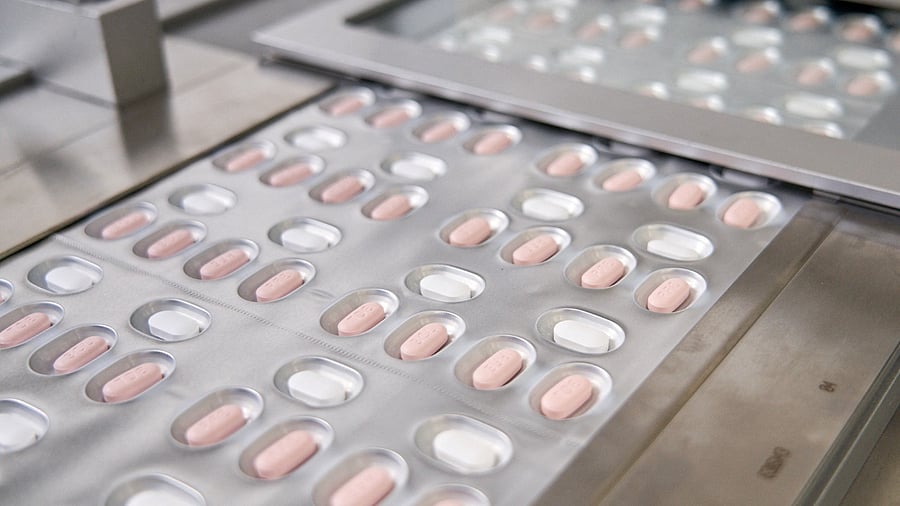 The Pfizer pills are taken with the older antiviral ritonavir every 12 hours for five days beginning shortly after onset of symptoms. Credit: Reuters Photo