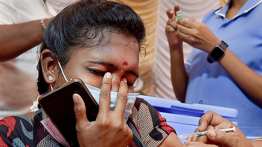 A beneficiary receives a dose of Covid-19 vaccine during a vaccination drive, in Chennai. Credit: PTI File Photo