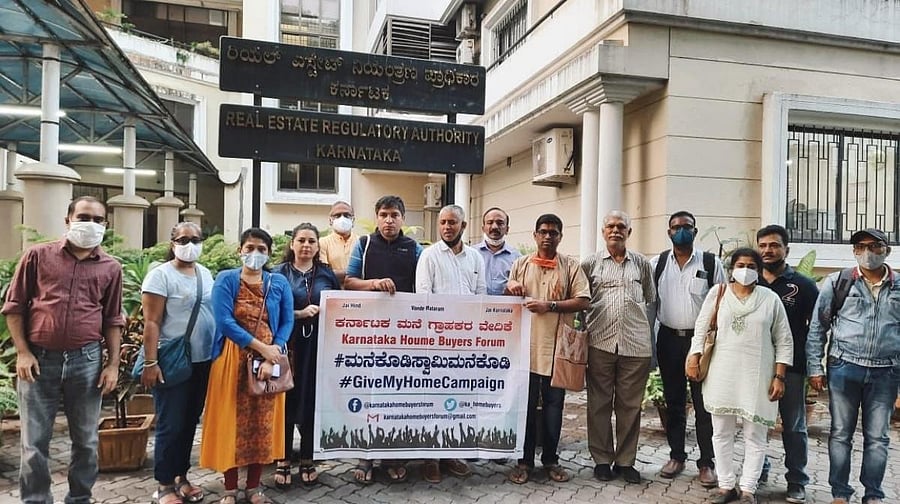 Members affected by delay staged a protest in front of RERA office on Sunday. Credit: DH Photo