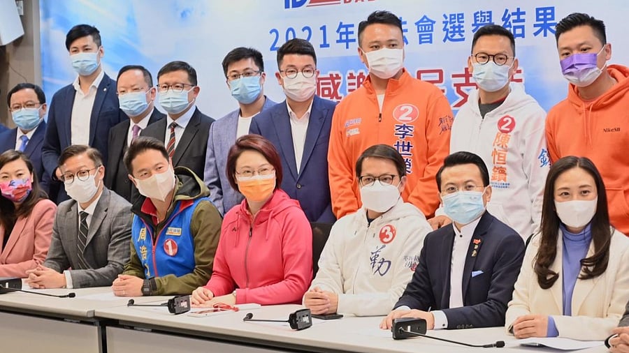 tarry Lee (bottom-C), chairwoman for the pro-Beijing Democratic Alliance for the Betterment and Progress of Hong Kong (DAB), speaks at a press conference with party members in Hong Kong on December 20, 2021 as Pro-Beijing candidates swept to victory in a "patriots only” legislature vote that saw record low turnout from voters and government loyalists sweep every seat. Credit: AFP Photo