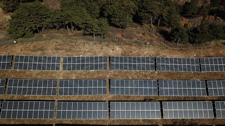 An aerial view of solar panels on hillsides at Huangjiao village in Baoding in China's northern Hebei province. Credit: AFP Photo