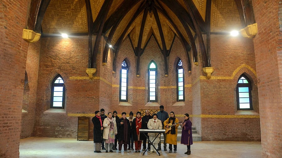 Devotees gather at the church ahead of its official reopening on December 23. Credit: PTI Photo