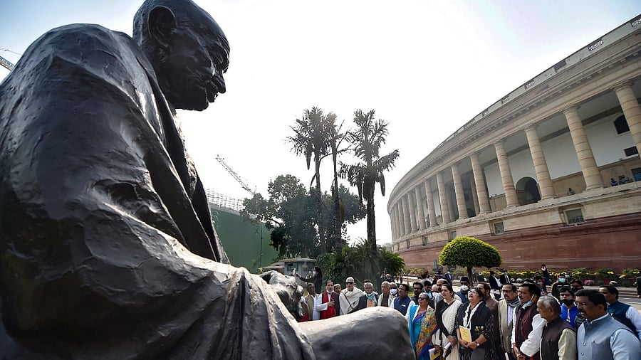 LoP Rajya Sabha Mallikarjun Kharge, opposition leaders along with suspended MPs read the Preamble to the Constitution of India and recite the national anthem to protest against the suspension of MPs. Credit: PTI Photo