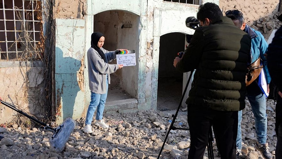 Students of a film school, prepare to shoot a scene, in the war-ravaged northern Iraqi city of Mosul. Credit: AFP Photo