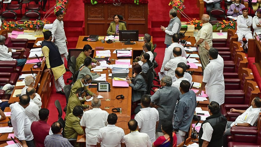 CM Bommai in a huddle with ministers Araga Jnanendra, KS Eshwarappa and Kota Srinivas Poojary in the Legislative Council. Credit: Ranju P/DH Photo