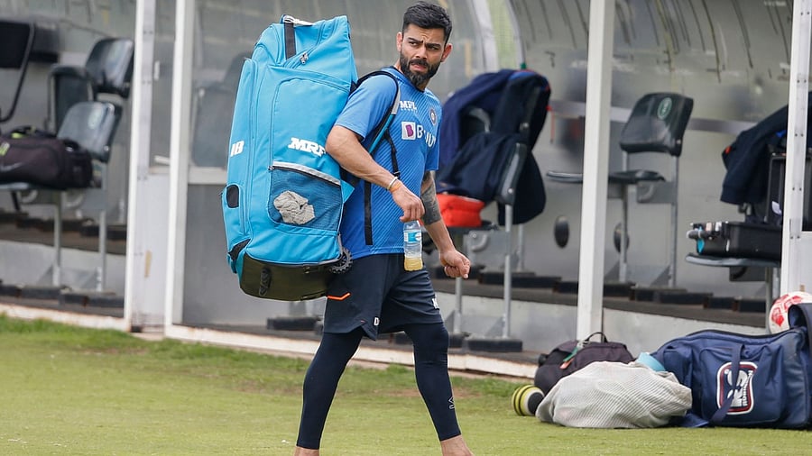 India's Virat Kohli leaves the pitch after training at SuperSport Park in Centurion on December 21, 2021. Credit: AFP Photo