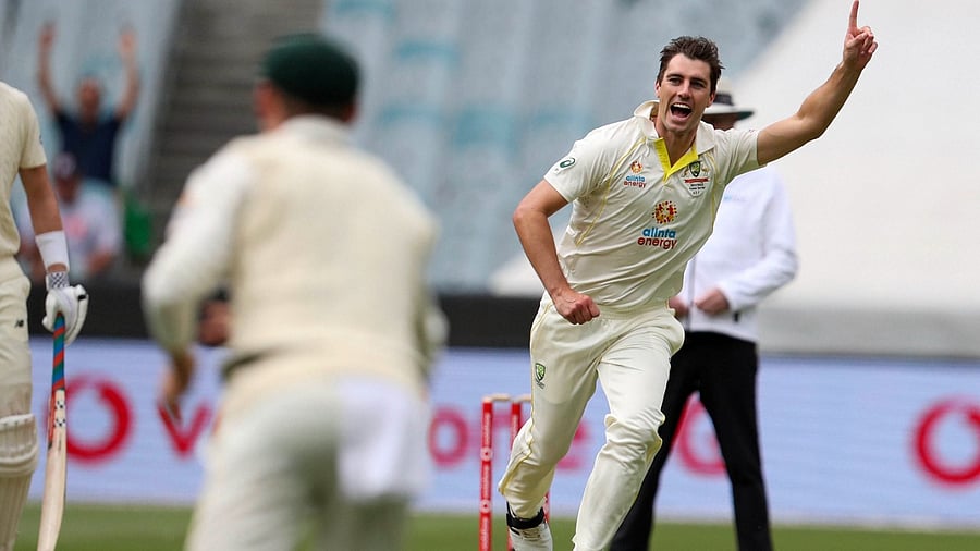 Australia's Pat Cummins celebrates taking the wicket of England's Haseeb Hameed during their cricket test match in Melbourne. Credit: AP/PTI Photo