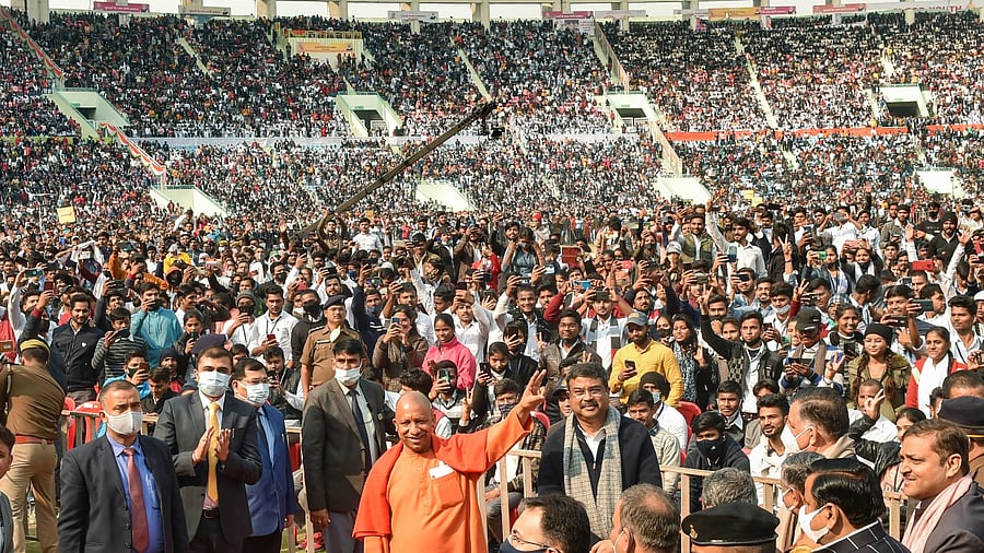 CM Yogi Adityanath at an event wherein he distributed smartphones and tablets to youth. Credit: PTI Photo