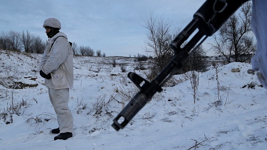 A militant of the self-proclaimed Luhansk People's Republic is seen at a fighting position on the line of separation from the Ukrainian armed forces. Credit: Reuters File Photo