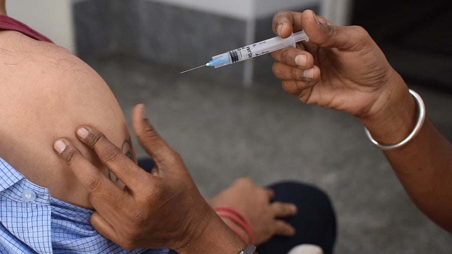 A beneficiary receives a dose of the Covid-19 vaccine at a hospital in Bengaluru. Credit: DH File Photo/Pushkar V
