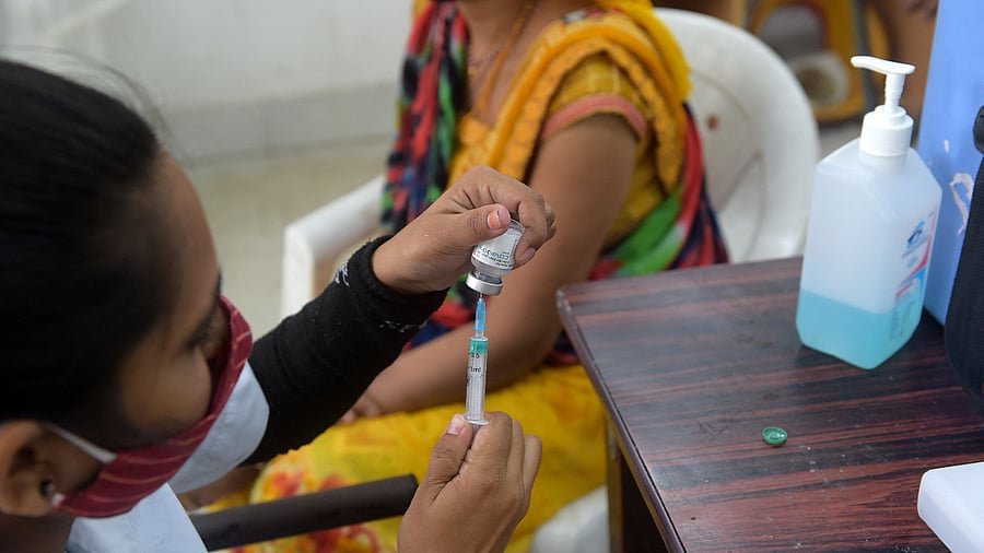 A health worker prepares a dose of the Covaxin vaccine against the Covid-19 Coronavirus at a vaccination centre. Credit: AFP Photo