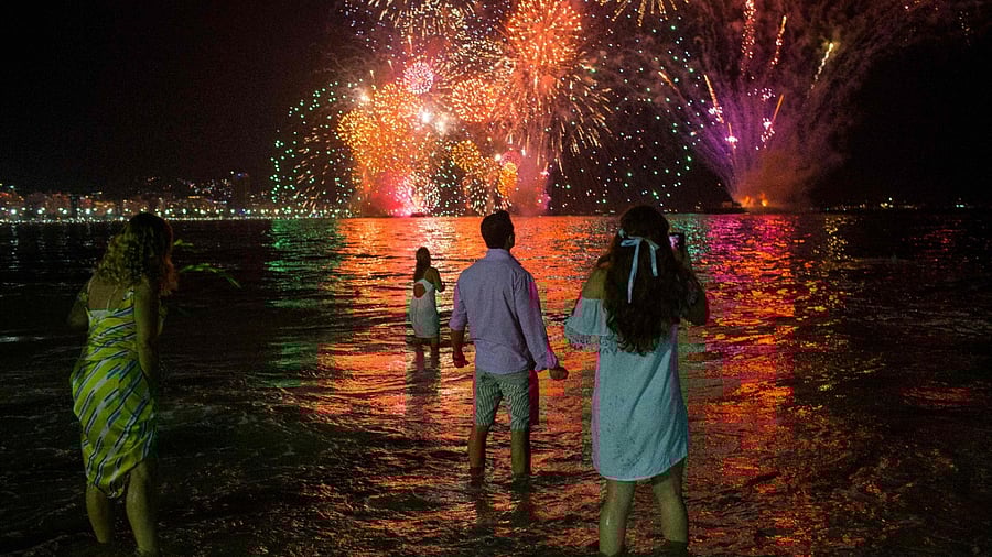 In Rio, celebrations that usually bring three million people to Copacabana Beach, will go ahead. Credit: AFP File Photo