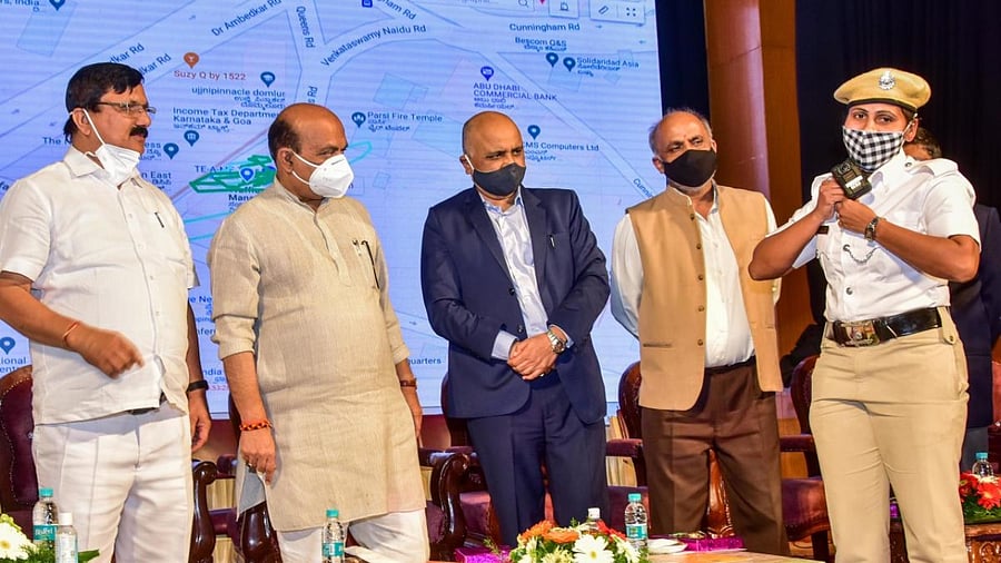 A traffic cop demonstrates the functioning of a body-worn camera at an event on Thursday. Credit: DH Photo/Prashanth H G