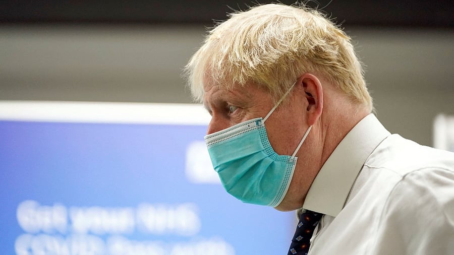 Britain's Prime Minister Boris Johnson looks on during a visit to a vaccination hub in the Guttman Centre at Stoke Mandeville Stadium in Aylesbury, Buckinghamshire, Britain January 3, 2022. Credit: Reuters Photo