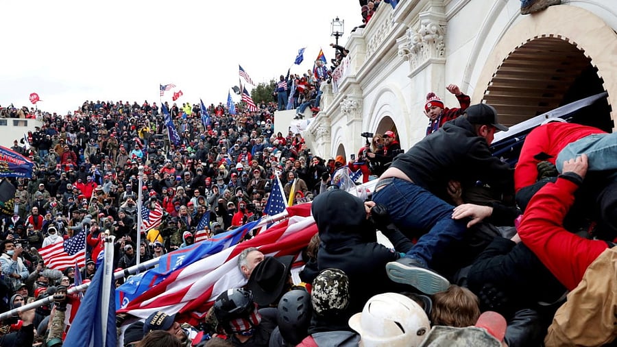Pro-Trump protesters storm into the US Capitol during clashes with police, during a rally to contest the certification of the 2020 US presidential election results by the US Congress, in Washington, US. Credit: Reuters Photo