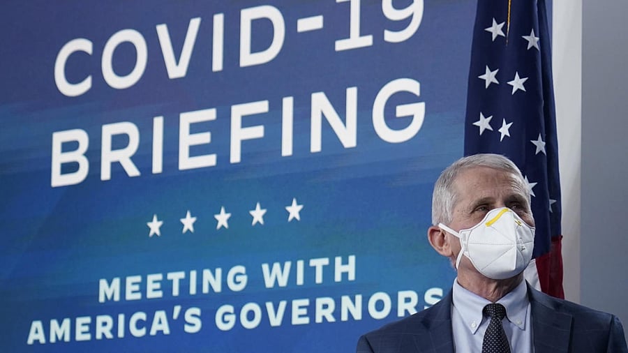  Dr. Anthony Fauci, the top US infectious disease expert, wears a face mask as he arrives for the the White House COVID-19 Response Team's regular call with the National Governors Association in the South Court Auditorium in the Eisenhower Executive Office Building on the White House Campus. Credit: AFP Photo