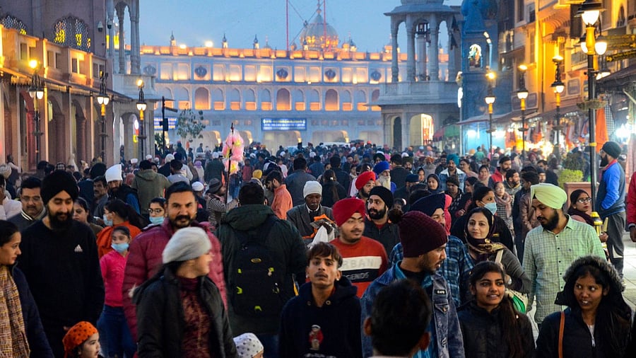People flout distancing norms and mask discipline in Amritsar around the festive season. Credit: PTI Photo