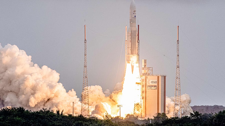 Arianespace's Ariane 5 rocket with NASA’s James Webb Space Telescope onboard lifts up from the launchpad. Credit: AFP Photo