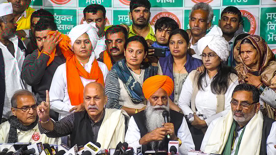 Senior SKM leaders address a press conference on the future course of the farmers agitation, at Singhu Border in New Delhi. Credit: PTI Photo