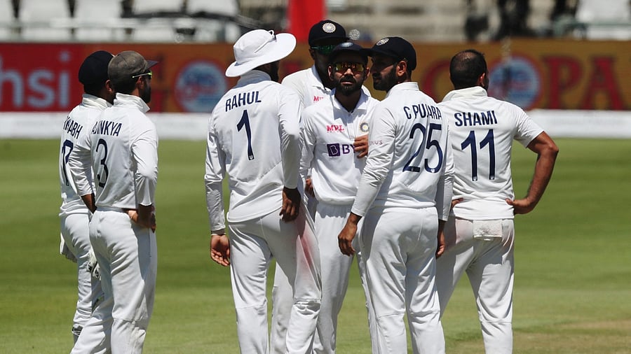 India's Virat Kohli and Mohammed Shami celebrate with teammates after taking the wicket of South Africa's Temba Bavuma. Credit: Reuters Photo