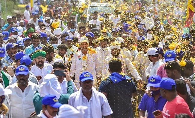 Defying Covid-19 curbs, Karnataka Congress's workers continued their 'padayatra\', demanding implementation of the Mekedatu project across the Cauvery river, even as FIRs have been registered against nearly 30 of its leaders and others for taking part in it, defying Covid-19 curbs. Credit: PTI Photo