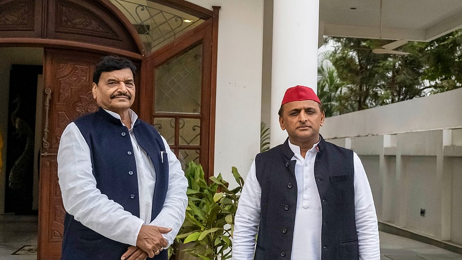 Shivpal Yadav and SP chief Akhilesh yadav (R). Credit: PTI Photo