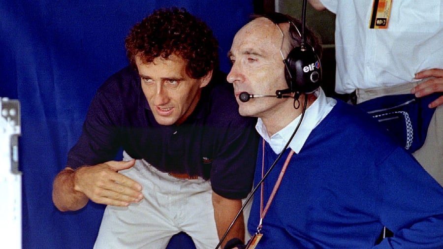 Three-time Formula One World Champion Alain Prost (L) talks to Renault-Williams team boss Frank Williams. Credit: Reuters File Photo