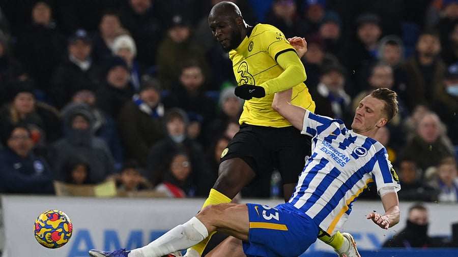 Brighton's English defender Dan Burn (R) tackles Chelsea's Belgian striker Romelu Lukaku (L) during the English Premier League football. Credit: AFP Photo