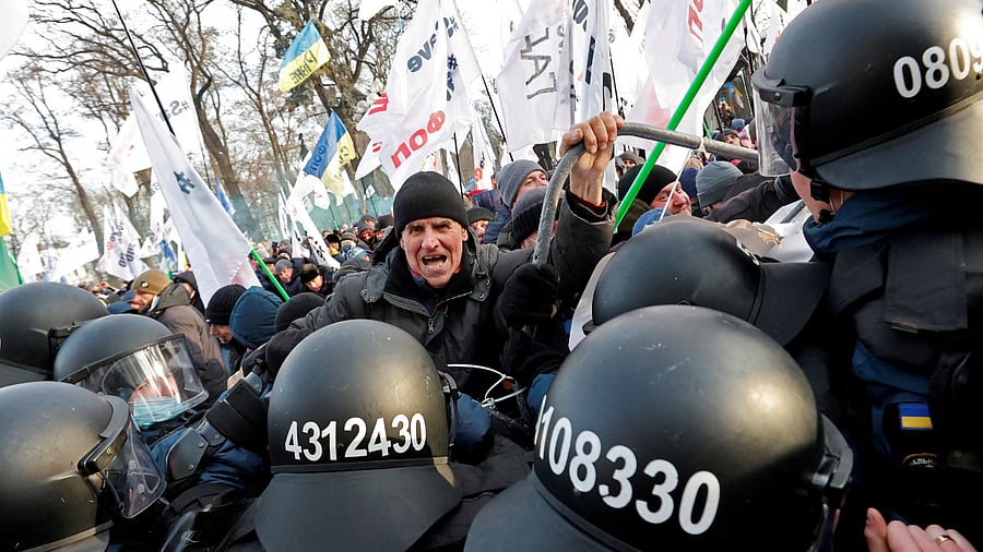 Demonstrators scuffle with Ukrainian law enforcement officers during a rally of entrepreneurs and representatives of small businesses who demand government support, in front of the parliament building in Kyiv. Credit: Reuters Photo