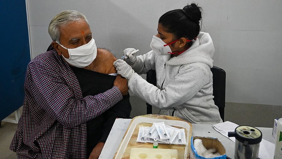 Healthcare workers and people aged above 60 years are likely to continue to get the 'precautionary' vaccine dose. Credit: AFP Photo