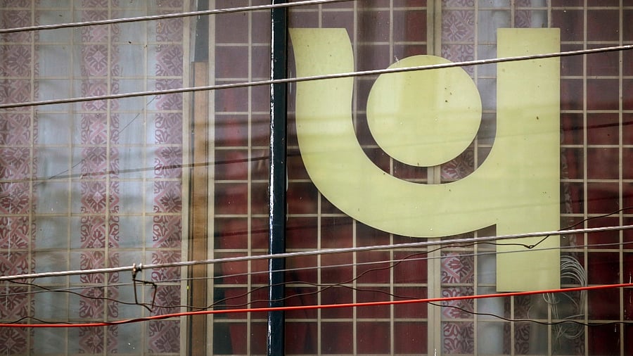 The logo of Punjab National Bank (PNB) is seen on a branch office window in New Delhi. Credit: Reuters File Photo