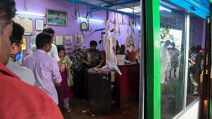 People line up at a meat shop in Bengaluru. Credit: DH File Photo