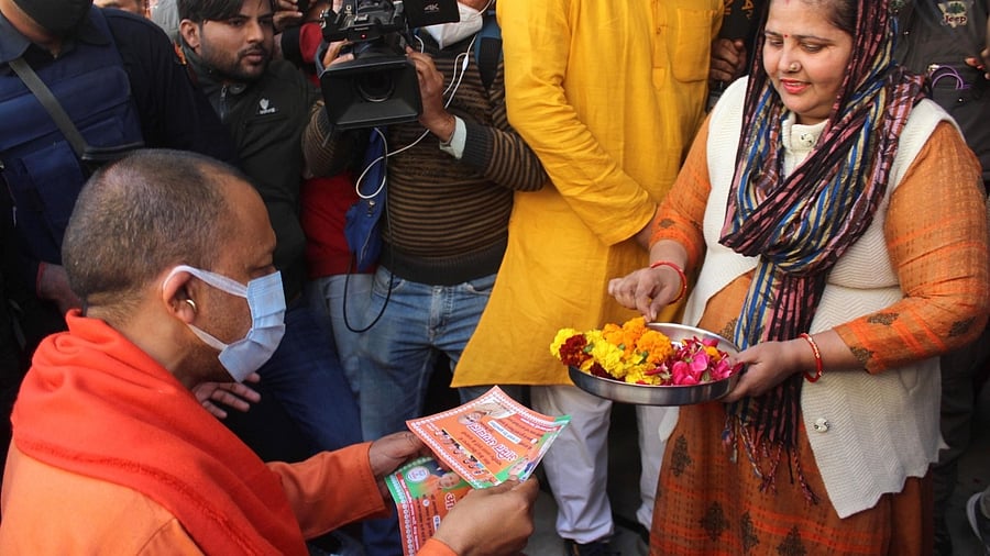 UP CM Yogi Adityanath during door to Door campaign for BJP Meerut Cant. candidate Amit Agarwal for upcoming assembly election at Kankarkhera in Meerut on Friday. Credit: IANS Photo