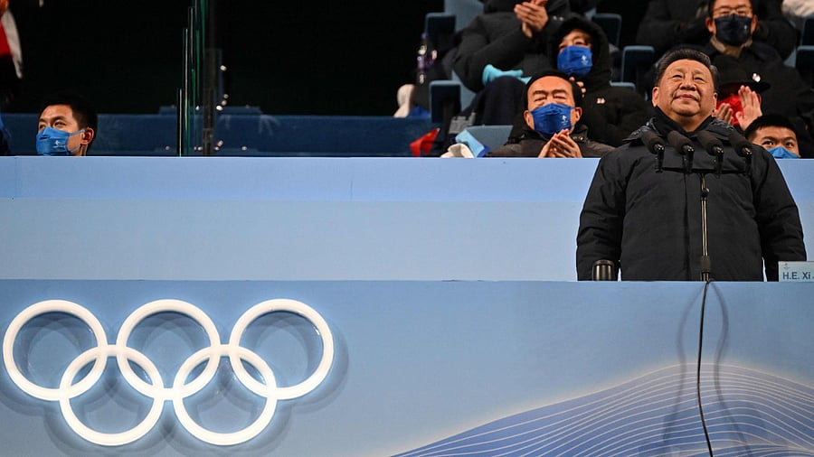 China's President Xi Jinping (R) announces the opening of the Beijing 2022 Winter Olympic Games. Credit: AFP Photo