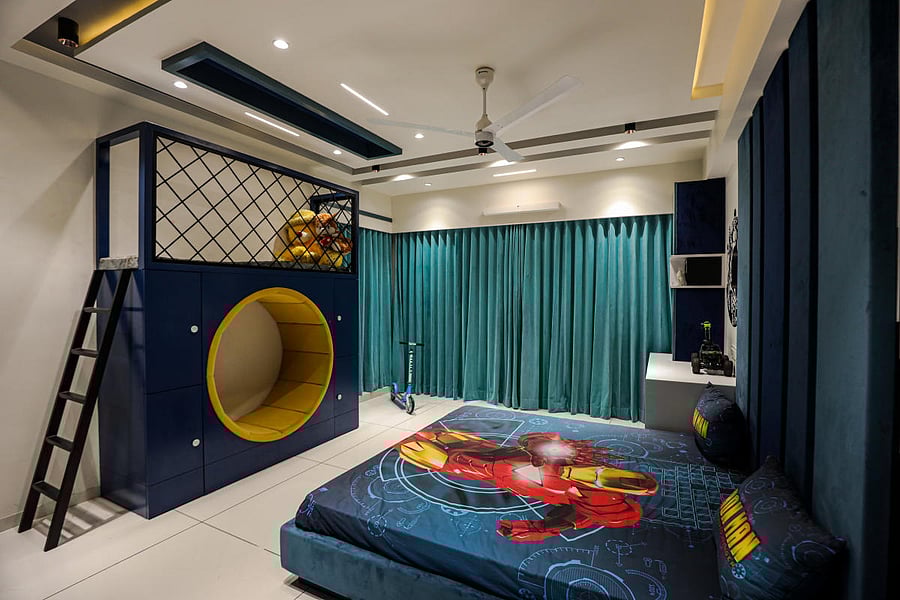A multipurpose unit by The Auura Interior Design Studio. The yellow circle, made of soft cushion fabric, is meant for sitting while the blue drawers and loft can be used for storing books and toys.
