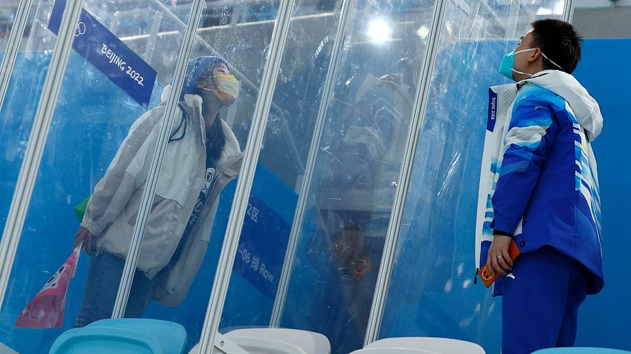 Dr Ding Hongtao, part of the medical staff, blows a kiss to his girlfriend through screens of glass that separate them because of the "closed loop," a coronavirus disease (Covid-19) prevention measure. Credit: Reuters File Photo