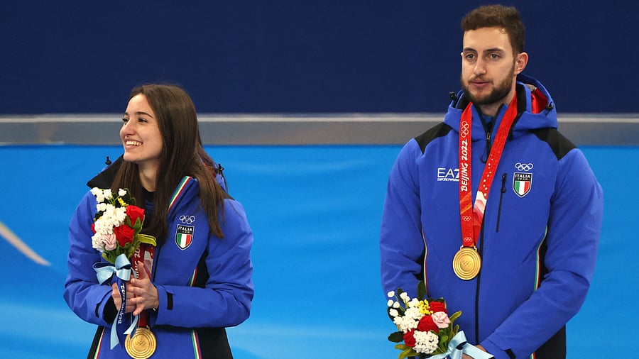 Gold medallists Stefania Constantini of Italy and Amos Mosaner of Italy celebrate. Credit: Reuters Photo