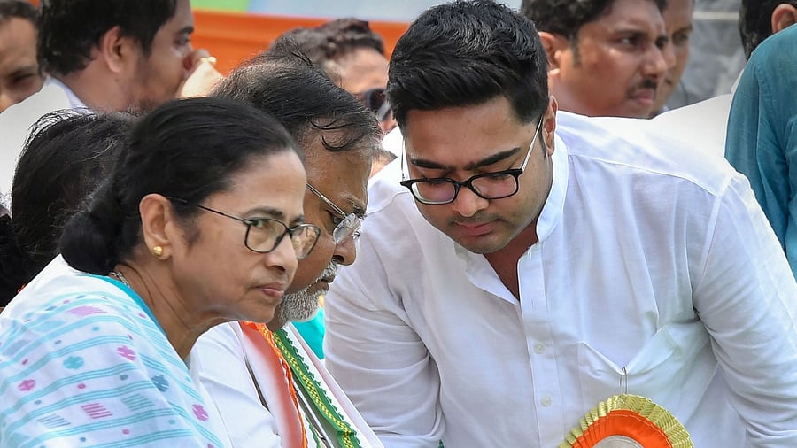 West Bengal Chief Minister Mamata Banerjee, Education Minister Partha Chatterjee and MP Abhishek Banerjee. Credit: PTI File Photo