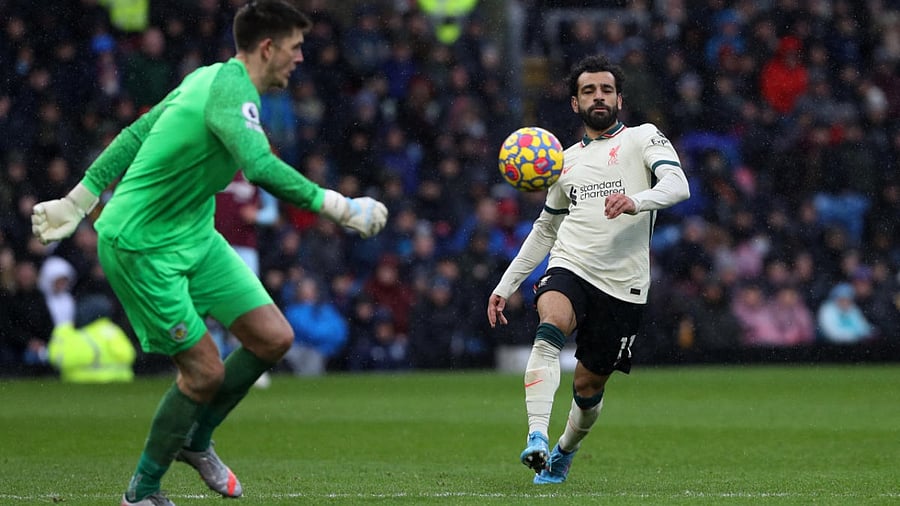 Liverpool's Mohamed Salah in action with Burnley's Nick Pope. Credit: Reuters Photo