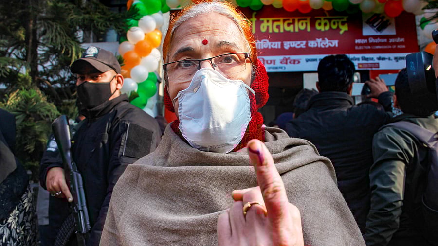woman shows her finger marked with indelible ink after casting vote, during the second phase of Uttar Pradesh Assembly elections. Credit: PTI Photo