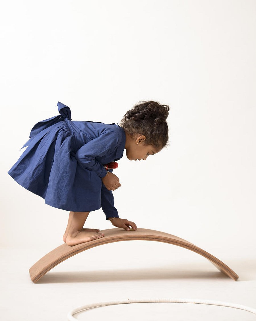 The board has a minimal form, and can be interpreted in several ways -- as a hill, bridge, a rainbow, a tunnel or a boat.