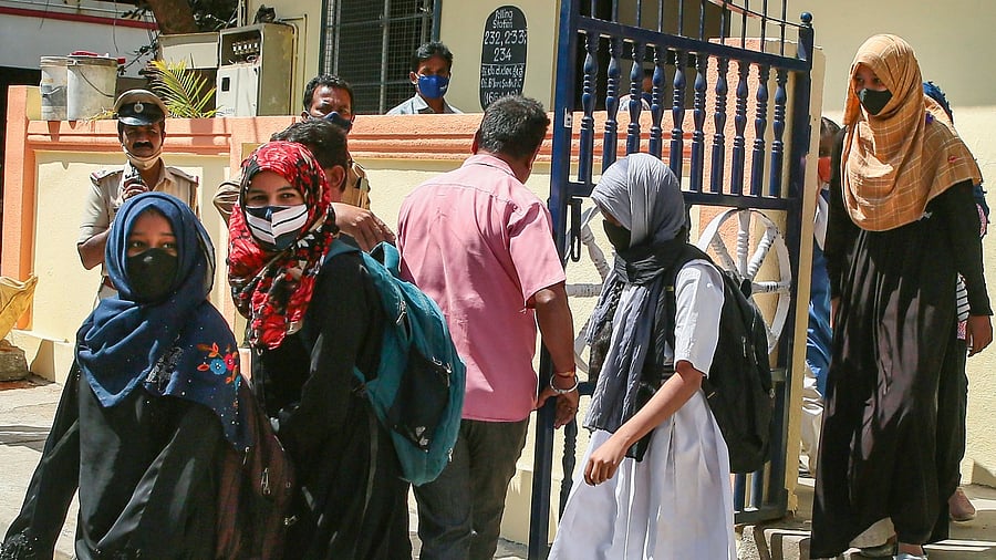 Students come out of their school after a teacher asked them to remove their hijab. Credit: PTI Photo