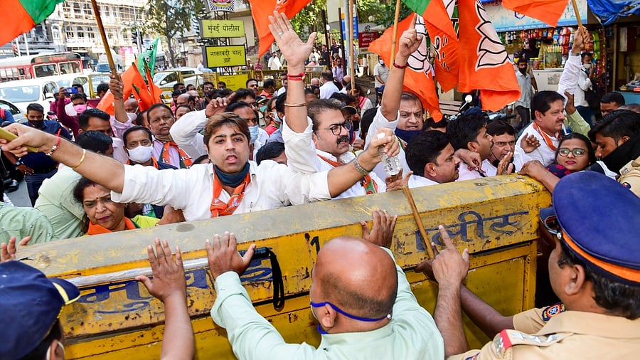 BJP workers hold a counter-protest over the Congress' protest. Credit: PTI Photo