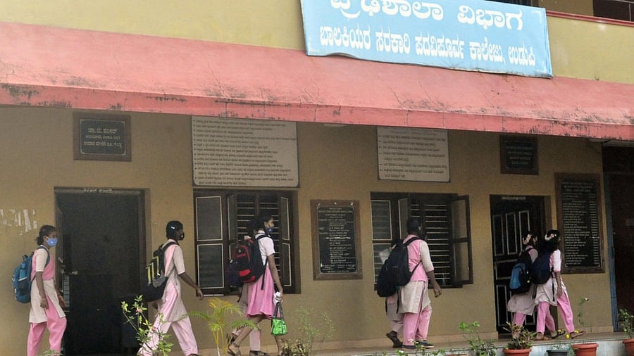 High school students arrive for preparatory exams at the Govt Pre-University College for Women in Udupi on Monday. Credit:DH Photo