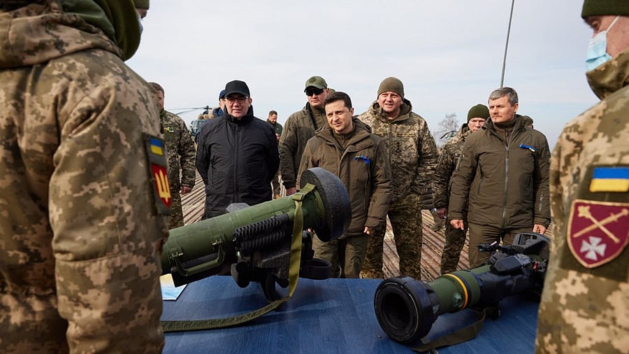 Ukrainian President Volodymyr Zelensky (C) listening to explanations during a military drill outside the city of Rivne, northern Ukraine. Credit: AFP Photo